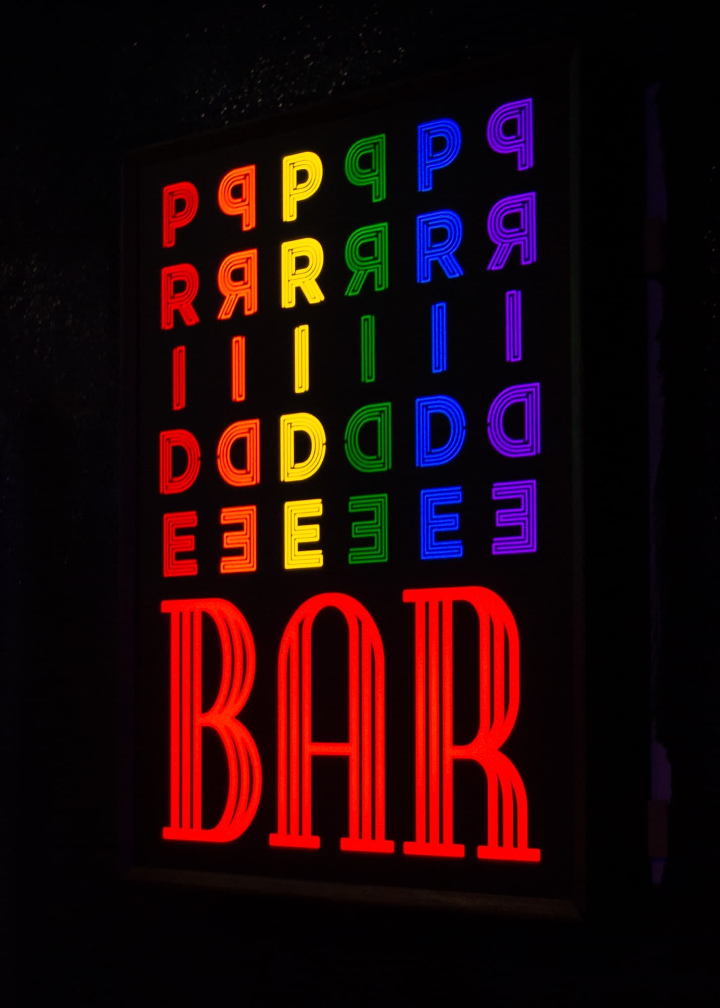 Pride of our Footscray sign glowing inside the venue